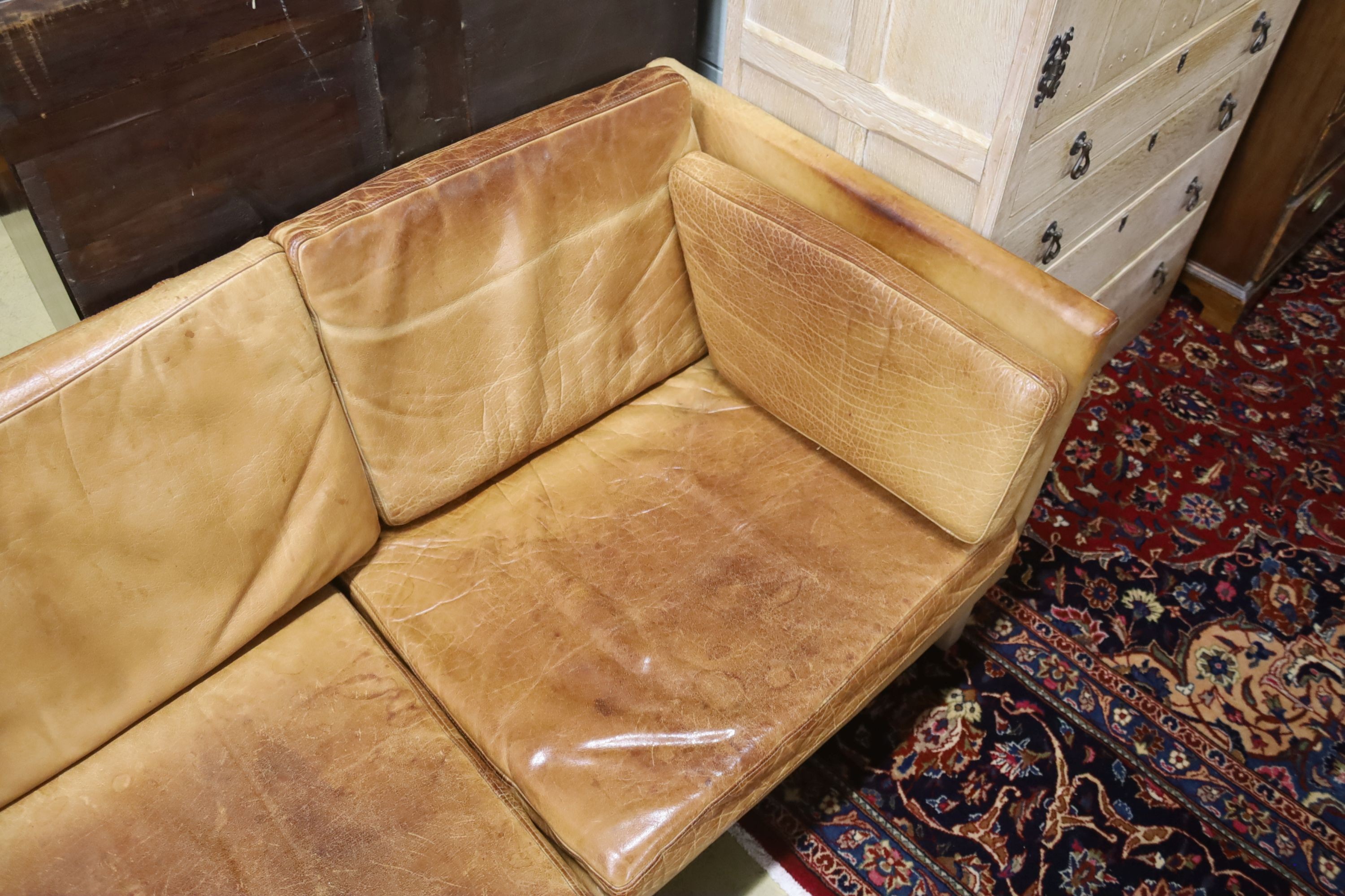 A Danish Borge Mogensen style tan leather three seater sofa, length 218cm, depth 78cm, height 66cm